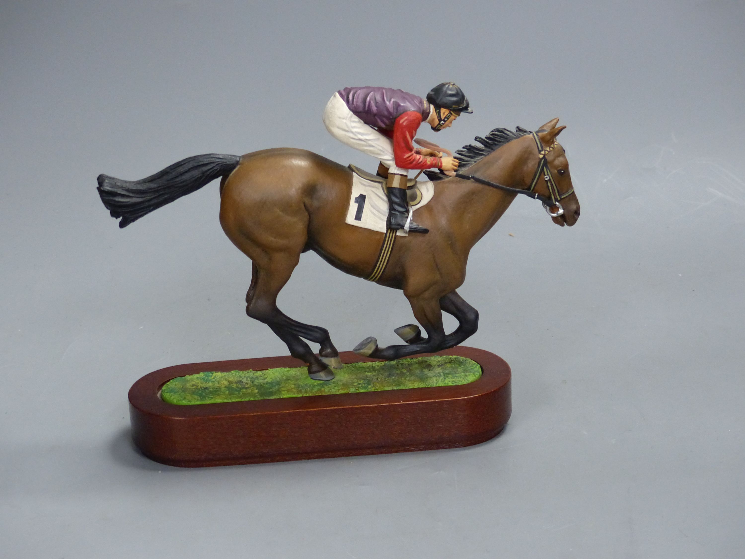 A Cameron Sculptures cold-painted bronze model of a racehorse with jockey up, height 16.5cm